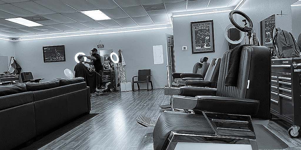 Line of barber chairs inside Imperium Barbers.