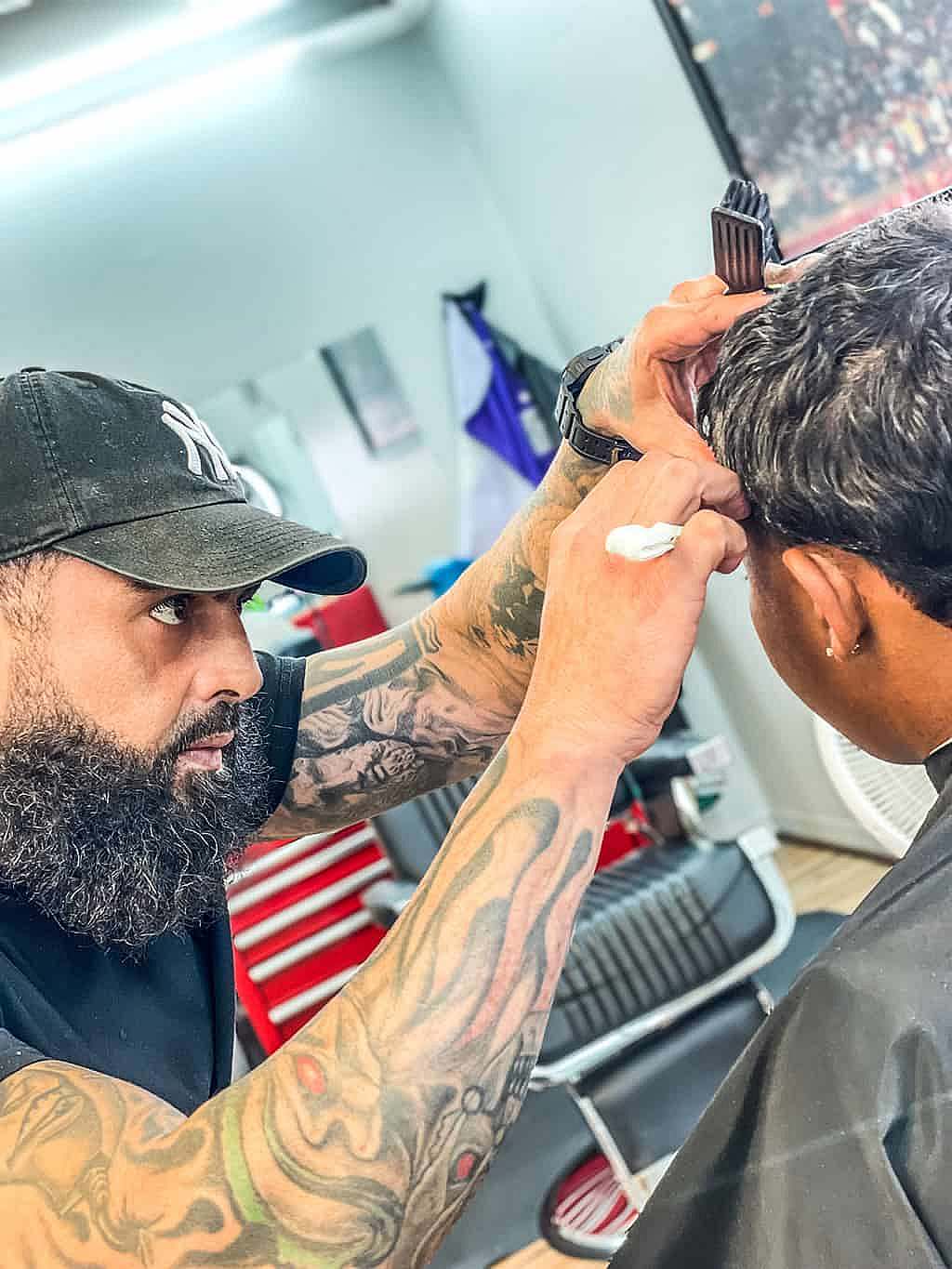 Jaime Barber Shaving Customer.